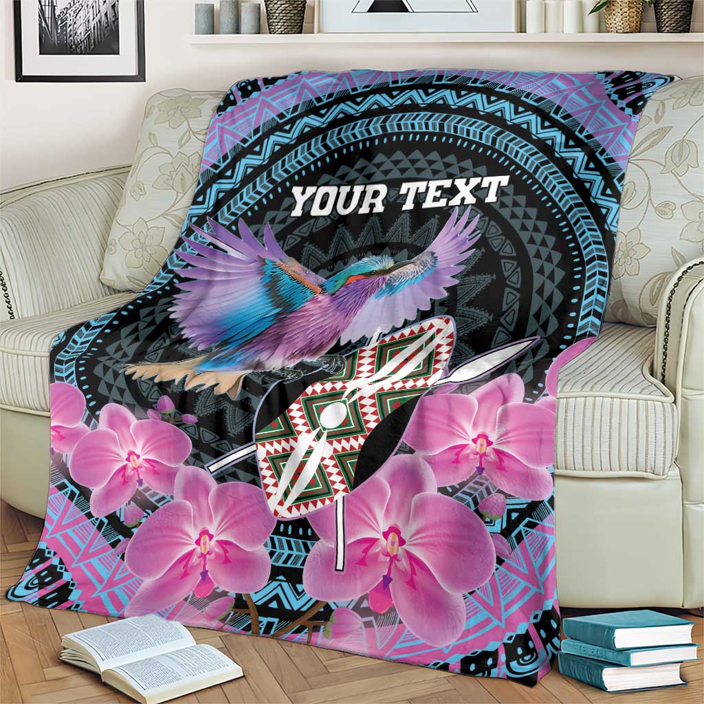 Personalized roller blanket draped on couch, purple orchids, bird, teal patterns, 'YOUR TEXT'