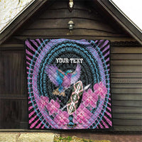Personalized quilt hanging indoors; turquoise circular pattern, bird, pink flowers, “YOUR TEXT”