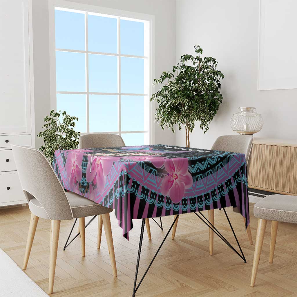 Purple and cyan orchid-pattern tablecloth on dining table with chairs