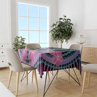 Purple and cyan orchid-pattern tablecloth on dining table with chairs