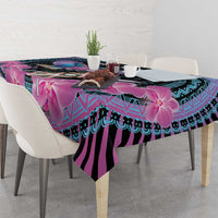 Purple, cyan and black orchid tablecloth draped across dining table