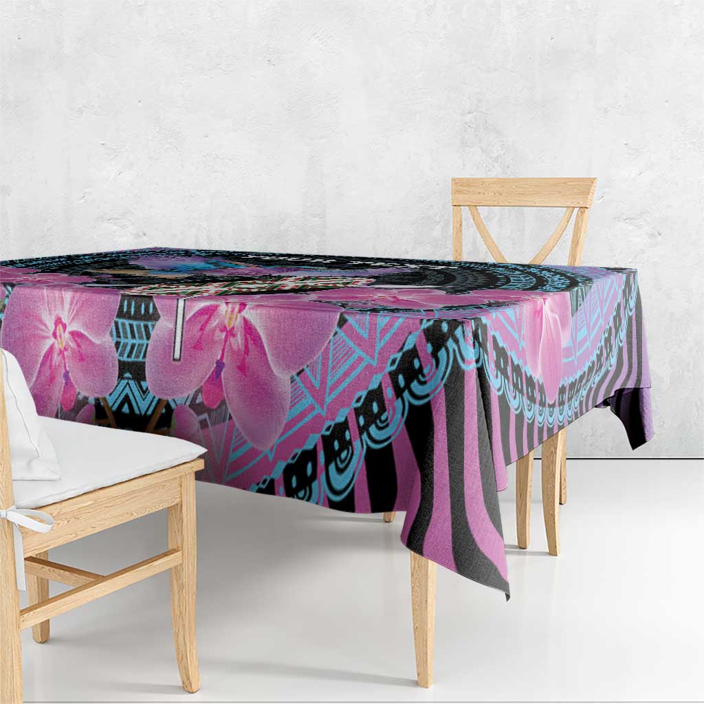 Orchid and geometric patterned tablecloth hanging over table edge, purple and cyan