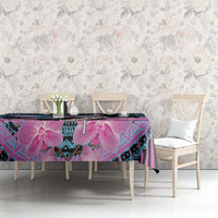 Orchid and geometric tablecloth on dining table, purple and cyan accents