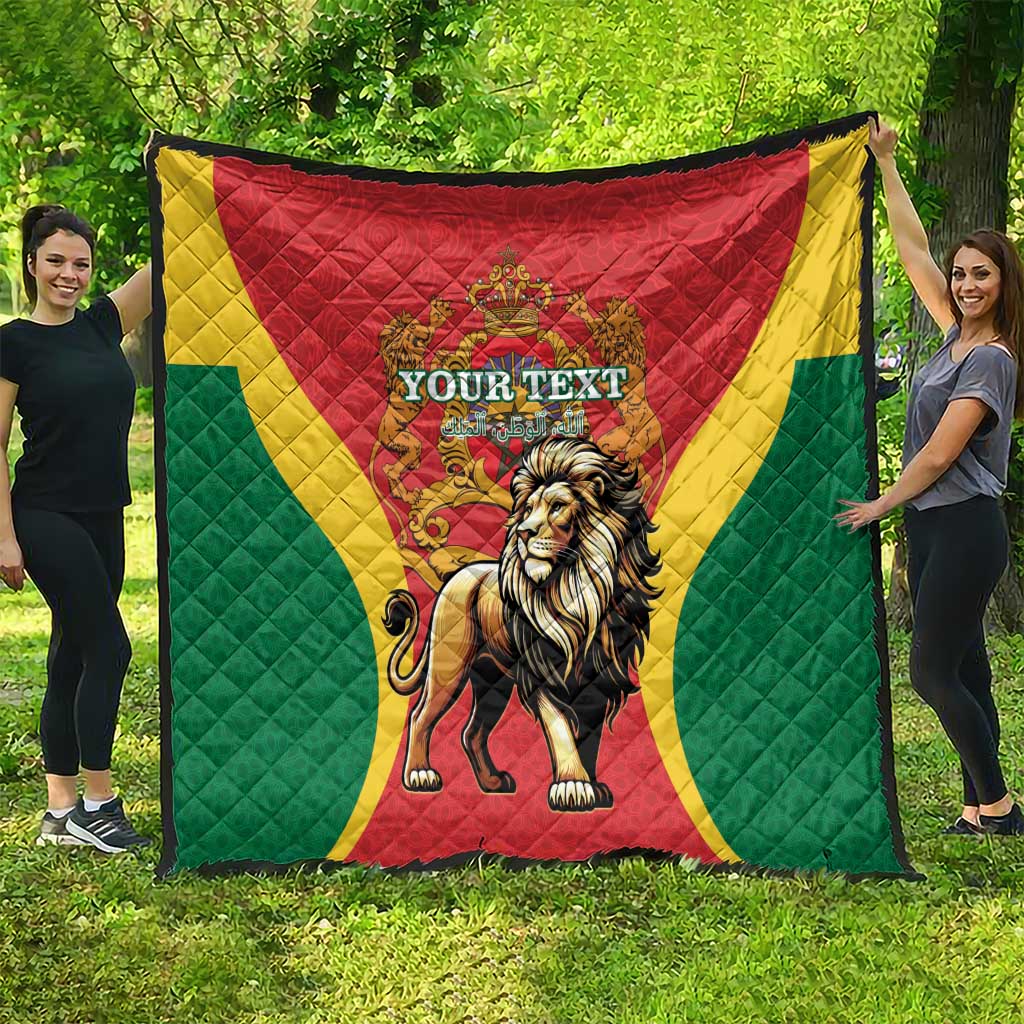 Large Moroccan quilt laid outdoors: red center with crowned lion, green field, yellow accents