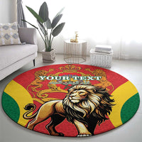 Red round area rug with lion graphic and ornate Islamic-inspired pattern