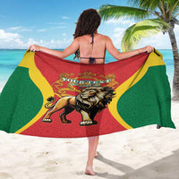 Red, green, and yellow lion-crest sarong with gold ornate border, wrap held open