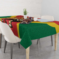 Red tablecloth with ornate lion motif, green drape and yellow border
