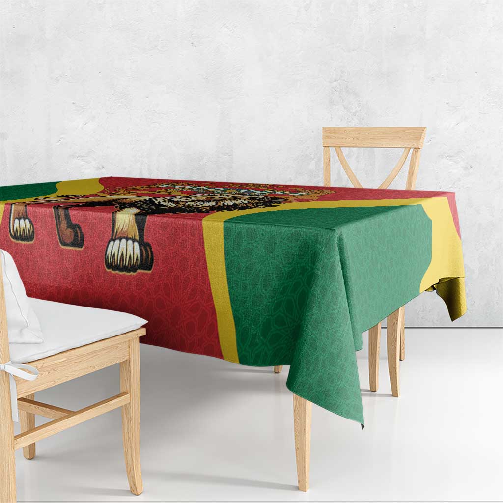 Red tablecloth with lion symbol, green drape and yellow frame
