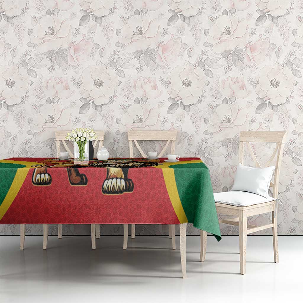 Red tablecloth with lion motif, green drape and yellow strip accents