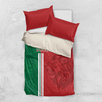 Red and green football bedding set with lion graphic, tricolor stripes, two red pillows, white accent