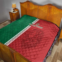 Morocco football quilt on bed, red and green quilted design with white triple stripe