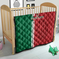 Morocco football quilt on crib, red and green quilted blanket with white triple stripe