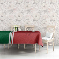 Red and green football tablecloth with white-striped border on a dining table