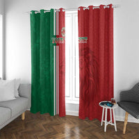 Red and green grommet-style window curtains on a rod with vertical stripe band