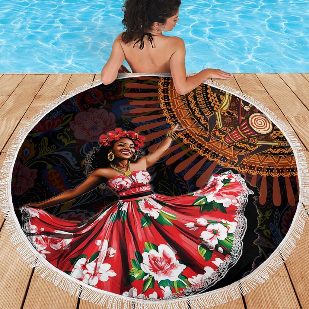 Circular beach blanket with black tribal and floral print and white fringe, shown draped