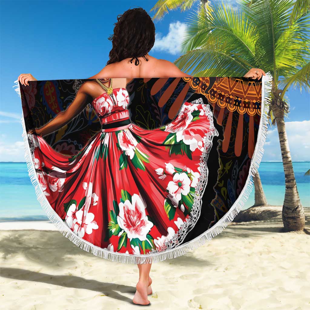 Round beach blanket with black base, red and green floral tribal print, white fringed border