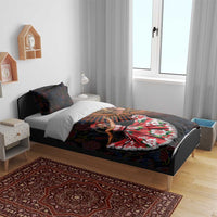 Duvet cover and pillows with dark paisley pattern, orange-and-gold mandala panel, red dress