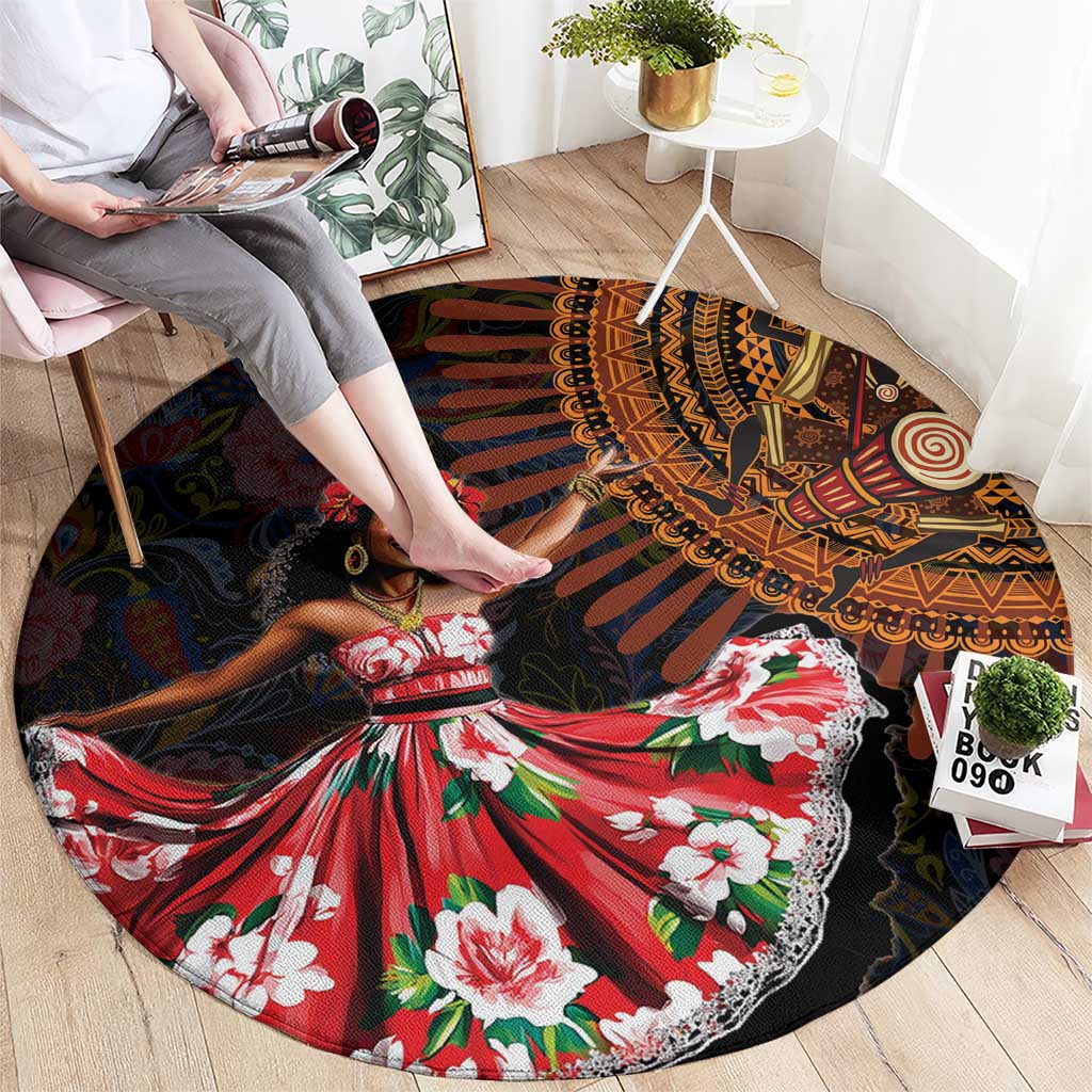 Round black patterned carpet with African dancer graphic, red dress, green and white flowers