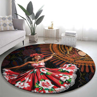 Round black rug featuring African dance figure in red floral dress with orange and yellow motifs