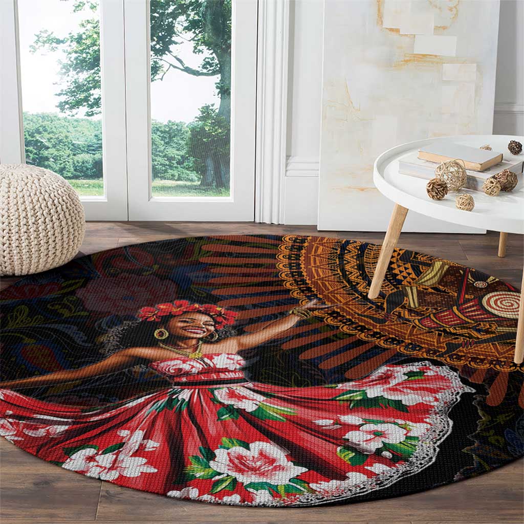 Round black floor rug with African dancer artwork and red, green, and white floral accents