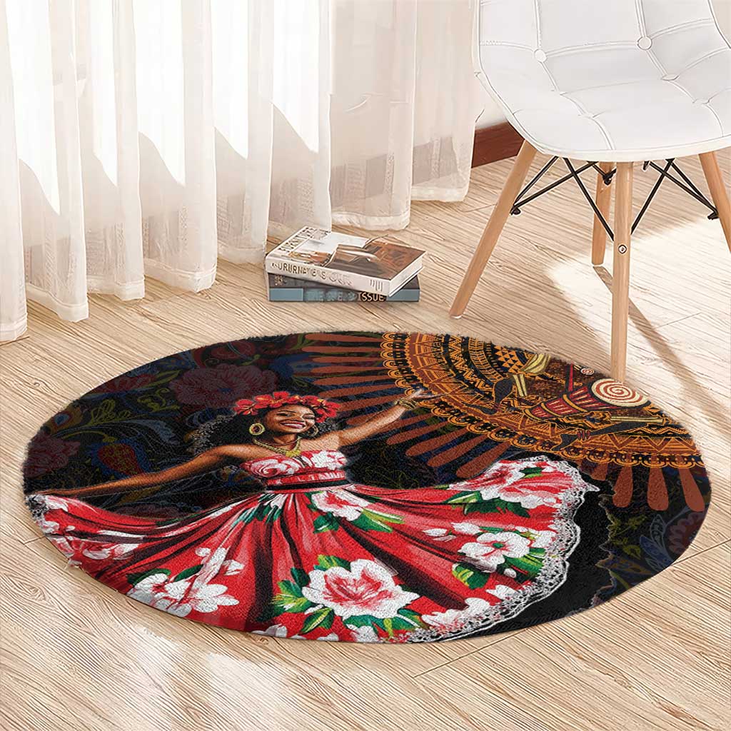 Round black area rug with African-inspired dancer print and red floral dress, green and white
