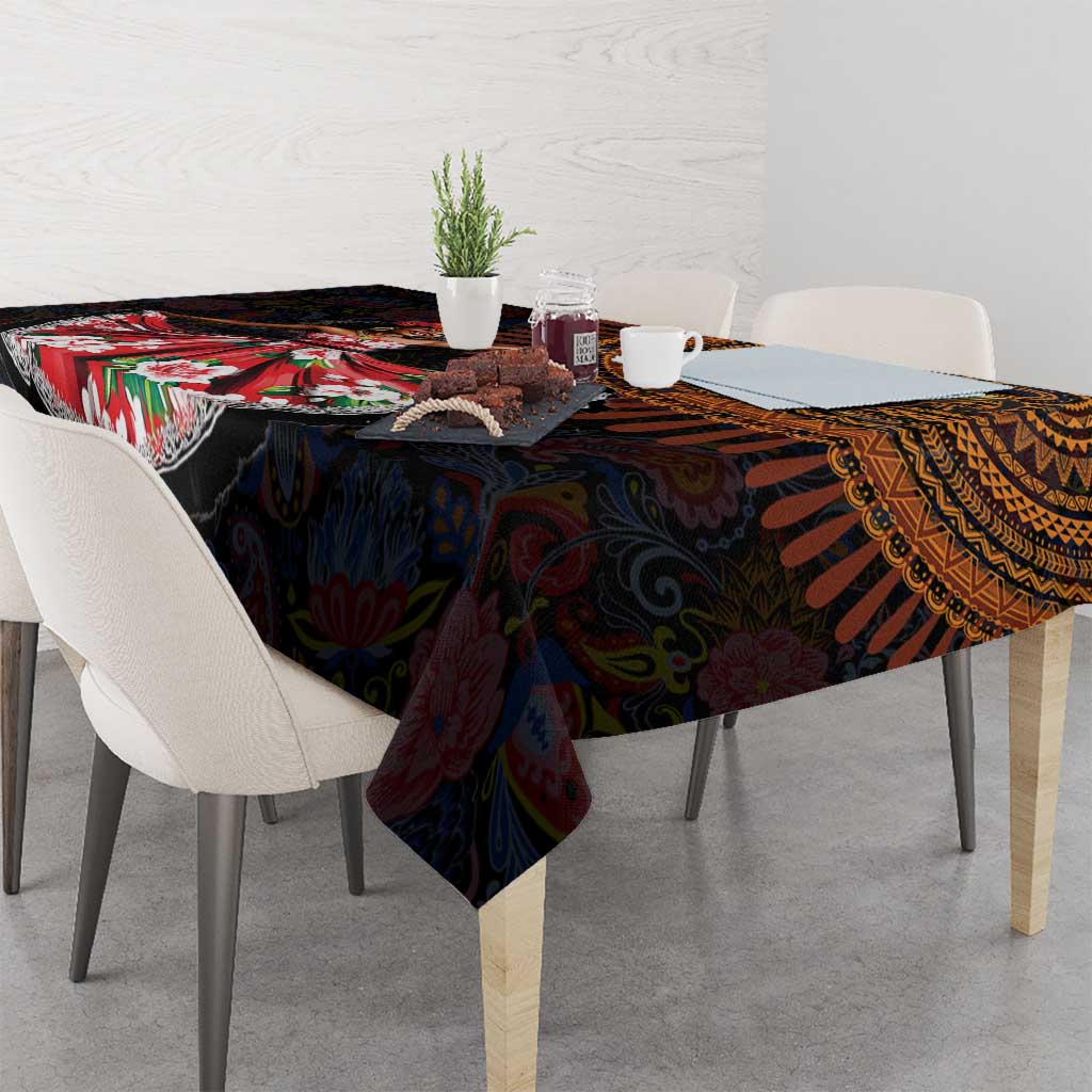Dark African paisley tablecloth draped over a dining table, showing colorful motifs