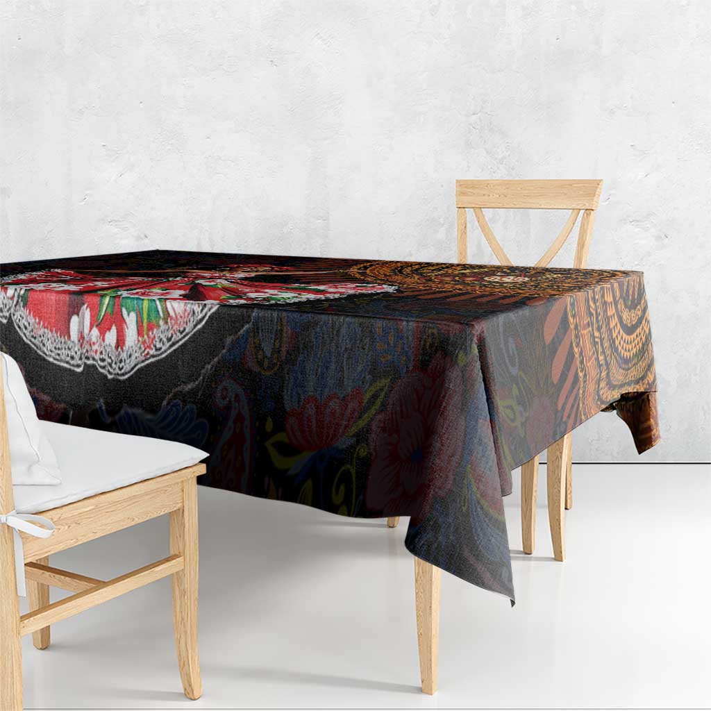 Dark patterned tablecloth with bold red and orange accents and paisley details