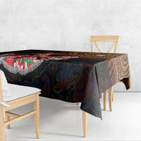 Dark patterned tablecloth with bold red and orange accents and paisley details