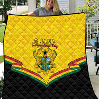 Ghana quilt blanket with yellow top and black bottom, Ghana crest and Kente-style stripes