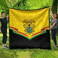 Folded Ghana quilt blanket, yellow panel with crest and multicolor stripe border on black