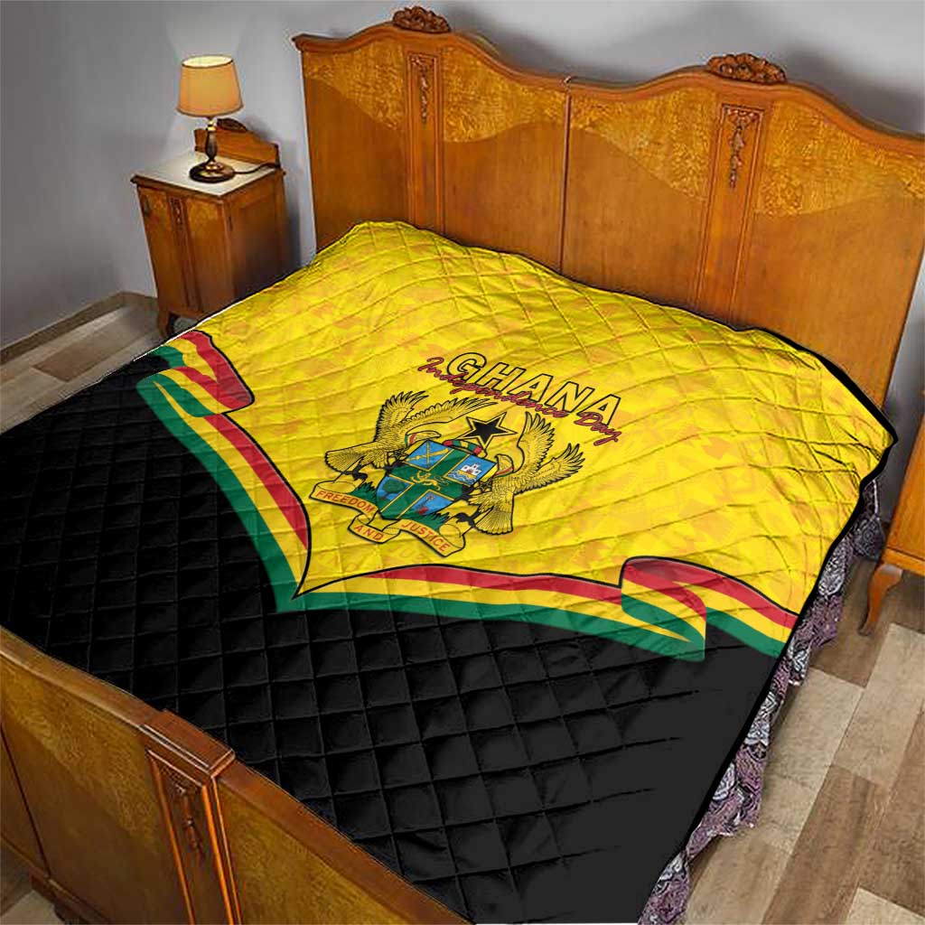 Ghana quilt blanket on bed, yellow top with crest and multicolor stripe design, black backing