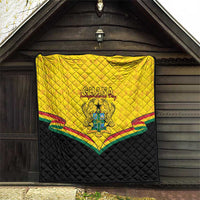 Ghana quilt blanket hanging indoors, yellow quilted top with crest, multicolor trim on black