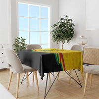 Ghana independence tablecloth on dining table with yellow top panel and green-red Kente stripes