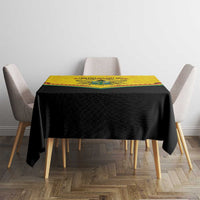 Ghana independence tablecloth on square table with black fabric and yellow Coat of Arms panel