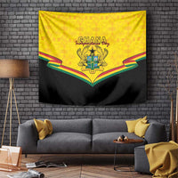 Yellow and black tapestry wall hanging featuring the Ghana coat of arms and multi-color ribbon.