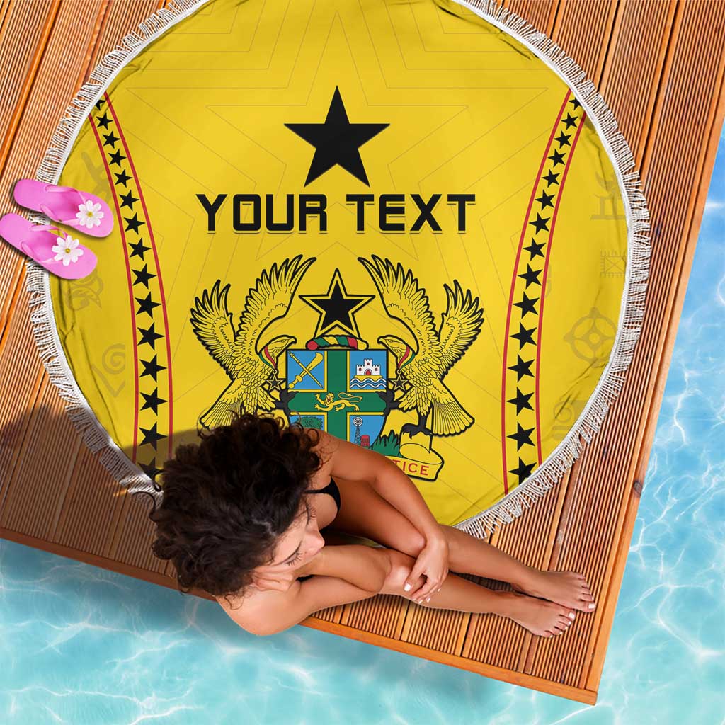 Circular yellow beach blanket with 'YOUR TEXT' and Ghana-style coat of arms, white fringe.
