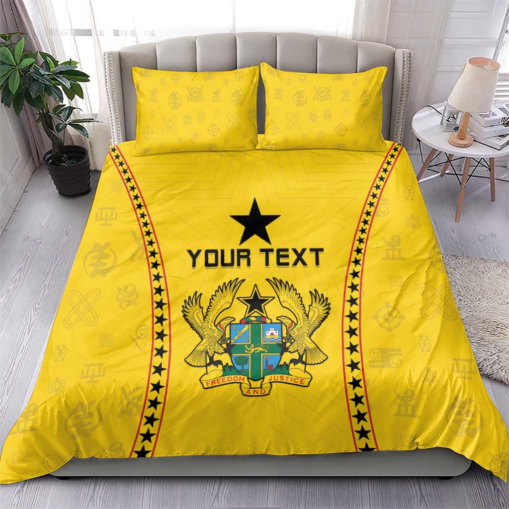 Yellow duvet and two pillowcases with centered black star, crest graphic, and red/black borders