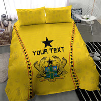 Yellow bedding set with crest and black star, “YOUR TEXT” on the duvet center