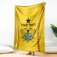 Yellow football blanket draped with black star border and central 'YOUR TEXT' emblem graphic