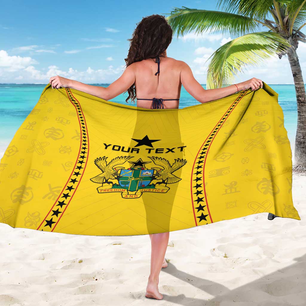 Yellow sarong worn as a swim wrap, OUR TEXT and crest centered with red star trim