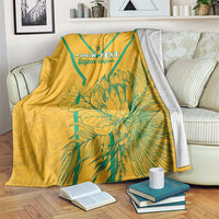 Yellow custom soccer blanket with teal diagonal stripes and bold 'YOUR TEXT' graphic