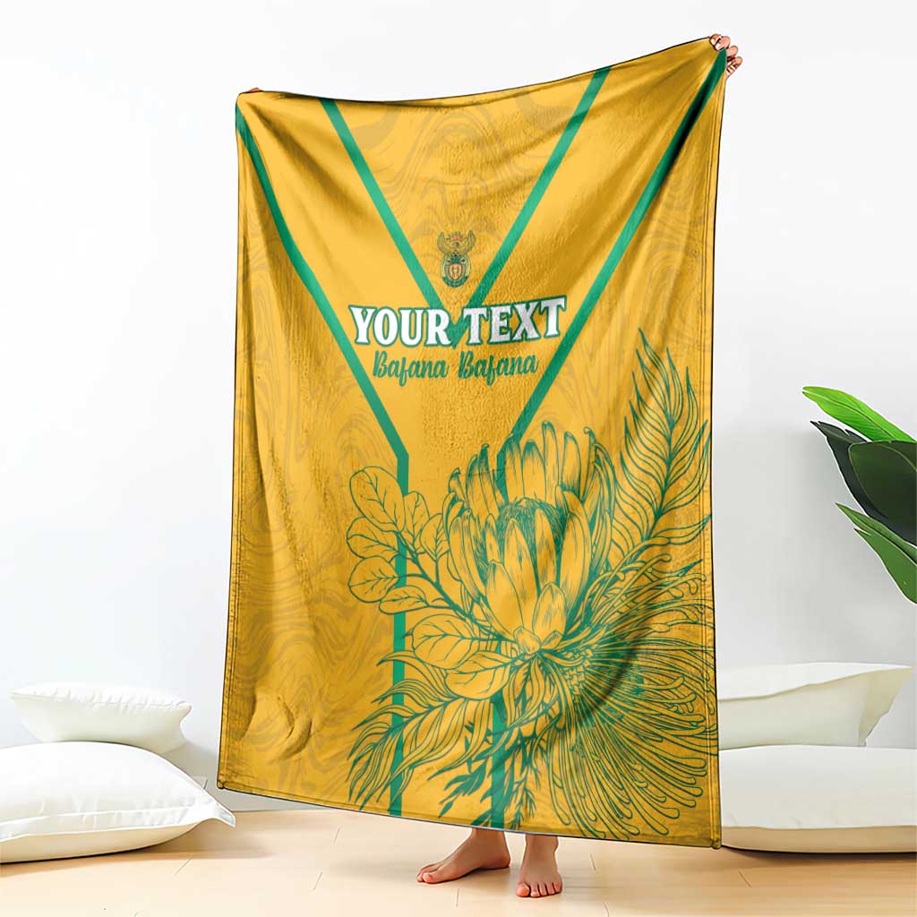 Yellow soccer blanket draped display, teal diagonal bands and large 'YOUR TEXT' print