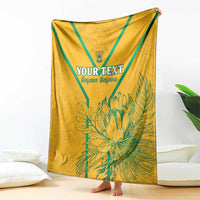 Yellow soccer blanket draped display, teal diagonal bands and large 'YOUR TEXT' print