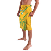 Yellow soccer lavalava shorts with leaf pattern, custom text and green diagonal stripe