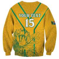 Yellow soccer sweatshirt with green V trim; “YOUR TEXT” “15” back print, flag sleeve patch.