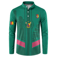 Green button sweatshirt with collar, Cameroon crest, and skyline graphic on front.