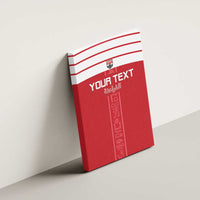 Red canvas wall art on wall with white stripes, "YOUR TEXT," and vertical hieroglyph design
