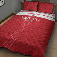 Red quilt bed set with white stripe band and 'YOUR TEXT' center print; two pillows