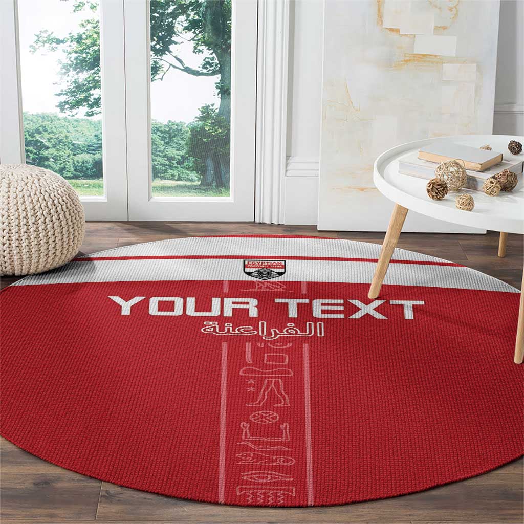 Red round football rug with YOUR TEXT and vertical pharaoh hieroglyph design
