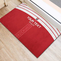 Red rubber doormat with white stripe border and personalized “Your Text” print